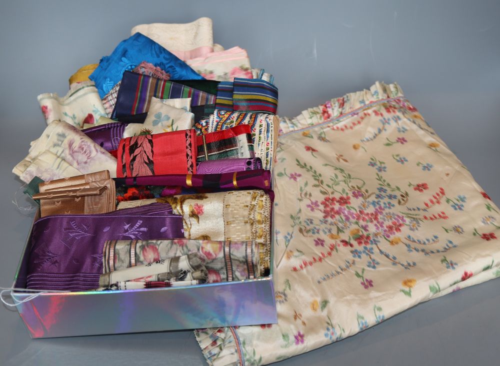 A printed 19th century coverlet and a collection of printed silk ribboning